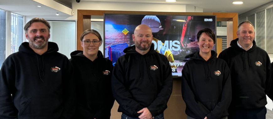 Kenny stood with colleagues
