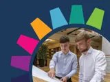 Two men looking at a technical drawing
