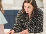 A woman dealing with a customer enquiry in an office