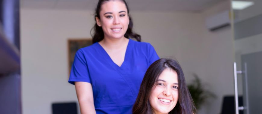 A female nurse with a female patient