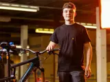 A young man working on a bike